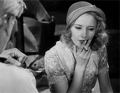 Stanwyck smokes like chimney