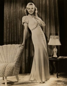 Florence Rice in gown with puffed sleeves and cross over bodice.