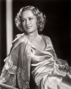 Miriam Hopkins in satin negligee.